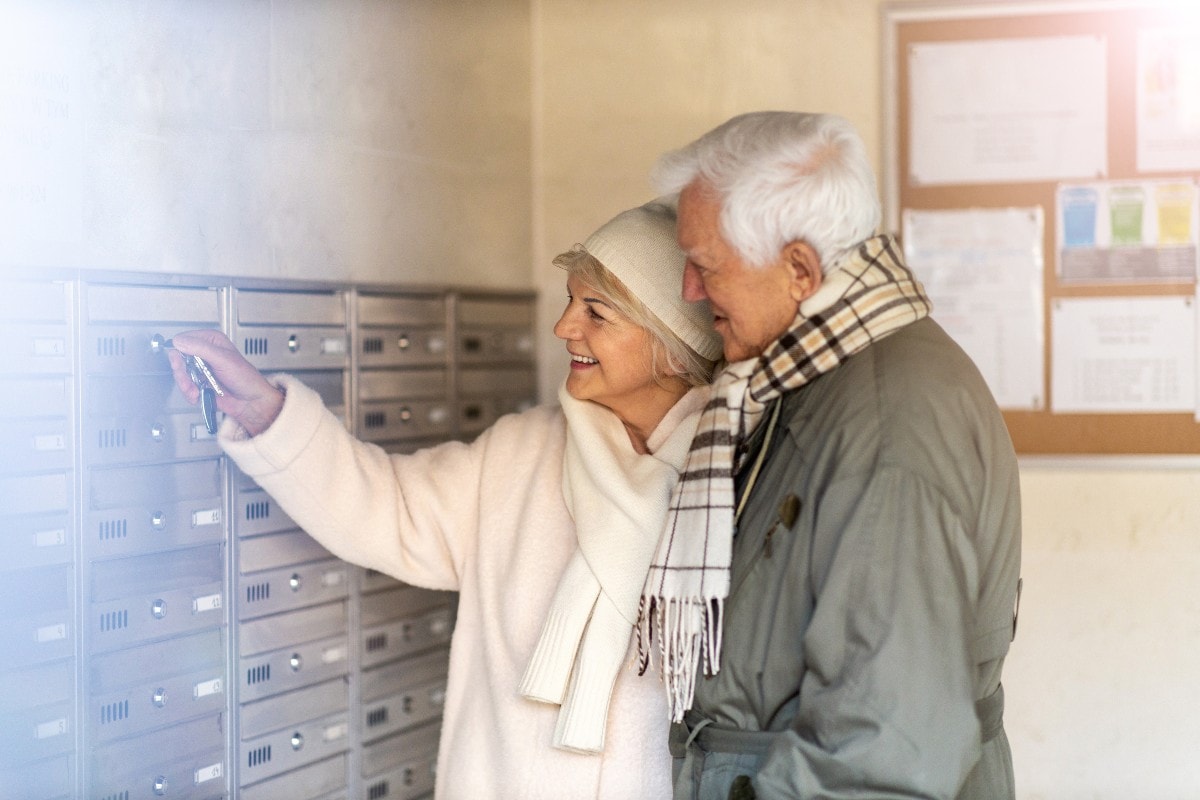 Healthcare direct mail marketing older couple checking mailbox web