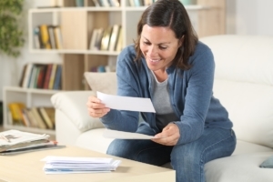 direct mail fundraising woman reading a letter