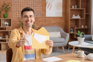 customized mailing lists smiling man holding envelope