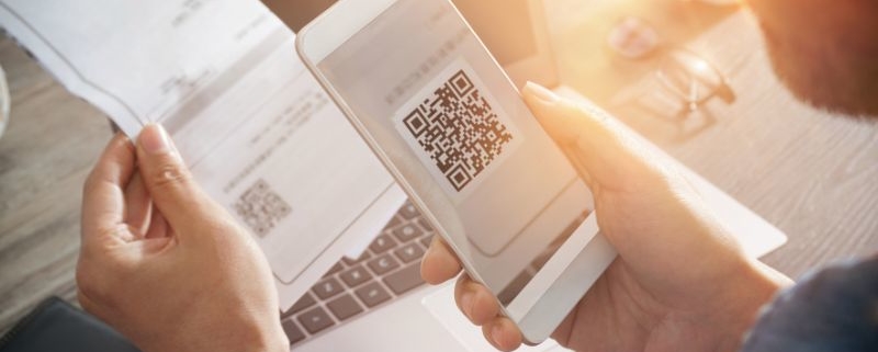 person scans direct mail QR code