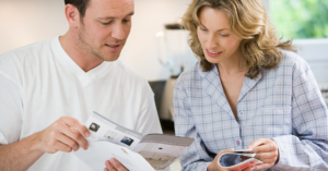 Adult couple looking at nonprofit mail